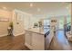 Open-concept kitchen with a granite island and stainless steel appliances, great for modern living at 262 Quay Dr, Lawrenceville, GA 30044