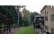 Expansive backyard featuring a deck, patio, well-manicured lawn, and mature trees at 2818 Willowstone Dr, Duluth, GA 30096