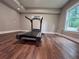 Finished basement exercise room showcasing a treadmill and natural light from the window at 2818 Willowstone Dr, Duluth, GA 30096
