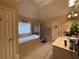 Bright bathroom with a soaking tub, glass-enclosed shower, and vanity at 2818 Willowstone Dr, Duluth, GA 30096