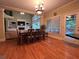 Spacious dining area with large windows and doors leading to the deck and open to the living room at 2818 Willowstone Dr, Duluth, GA 30096