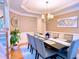 Elegant dining room featuring modern decor, a stylish chandelier, and seating for eight at 2818 Willowstone Dr, Duluth, GA 30096