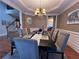 Formal dining room with a modern chandelier, seating for eight, and stylish decor at 2818 Willowstone Dr, Duluth, GA 30096