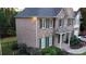 Side view of a brick home with a two-car garage, manicured landscaping, and a welcoming front porch at 2818 Willowstone Dr, Duluth, GA 30096