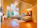 Spacious living room boasting hardwood floors, large windows, and a cozy fireplace at 2818 Willowstone Dr, Duluth, GA 30096