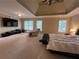 Generously sized main bedroom featuring tray ceilings, three windows, and a lounge chair at 2818 Willowstone Dr, Duluth, GA 30096
