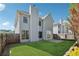 Backyard featuring lush green grass and a view of the house's exterior at 400 Mirramont Ln, Woodstock, GA 30189