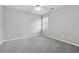 Neutral bedroom features light gray walls, carpet, a ceiling fan and a window at 400 Mirramont Ln, Woodstock, GA 30189