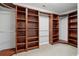 Walk-in closet featuring adjustable shelving and ample storage space at 400 Mirramont Ln, Woodstock, GA 30189