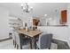 Open-concept dining room flows into the living room and kitchen at 400 Mirramont Ln, Woodstock, GA 30189