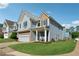 Beautiful two-story home with a well-maintained lawn and inviting front porch at 400 Mirramont Ln, Woodstock, GA 30189