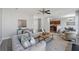 Cozy living room with open floor plan to the kitchen and dining room at 400 Mirramont Ln, Woodstock, GA 30189