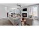 Bright living room features a fireplace and backyard access at 400 Mirramont Ln, Woodstock, GA 30189