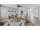 Open-concept living room with modern furnishings and luxury vinyl floors at 400 Mirramont Ln, Woodstock, GA 30189