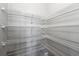 Walk-in pantry with ample white wire shelving for organized storage at 400 Mirramont Ln, Woodstock, GA 30189