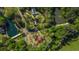Drone shot of a house in a heavily wooded area, situated near lakes at 6515 Namon Wallace Dr, Cumming, GA 30028