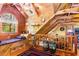 Inviting attic bedroom with slanted ceilings, custom storage, and access to other spaces at 6515 Namon Wallace Dr, Cumming, GA 30028