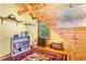 Charming attic room with sloped ceilings, built-in shelving, and natural light at 6515 Namon Wallace Dr, Cumming, GA 30028
