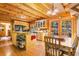 Open-concept kitchen with wood cabinets, stainless appliances, and a view to the dining area at 6515 Namon Wallace Dr, Cumming, GA 30028