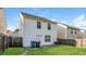 Home backyard featuring a partial fence and green grass at 7503 Garnet Dr, Jonesboro, GA 30236