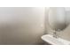 Bathroom with white sink with a circular mirror at 7503 Garnet Dr, Jonesboro, GA 30236