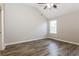 Bedroom with a vaulted ceiling, ample natural light, and modern flooring at 7503 Garnet Dr, Jonesboro, GA 30236