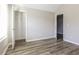 Bright bedroom featuring vinyl plank flooring, closet and large window at 7503 Garnet Dr, Jonesboro, GA 30236