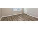 Bright bedroom featuring vinyl plank flooring and a view from the window at 7503 Garnet Dr, Jonesboro, GA 30236