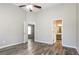 Spacious bedroom boasts new luxury vinyl plank flooring and ensuite bathroom access at 7503 Garnet Dr, Jonesboro, GA 30236