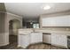 Well-lit kitchen with stainless steel appliances and white countertops at 7503 Garnet Dr, Jonesboro, GA 30236