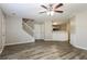 Bright living room with staircase, bar access, and modern flooring at 7503 Garnet Dr, Jonesboro, GA 30236