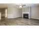 Spacious living room featuring a fireplace, modern flooring, and neutral paint at 7503 Garnet Dr, Jonesboro, GA 30236