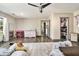 Spacious bedroom with a walk-in closet, vanity, dresser, and a cozy rug, perfect for relaxation at 95 Graystone Dr, Covington, GA 30014