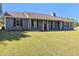 Inviting single-story home with a well-maintained lawn and dark shutters at 95 Graystone Dr, Covington, GA 30014