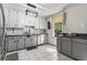 Updated kitchen with stainless steel appliances, subway tile backsplash, and ample counter space at 95 Graystone Dr, Covington, GA 30014