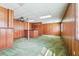 Large basement featuring wood paneled walls, drop ceilings, and a retro bar at 1735 Little Willeo Rd, Marietta, GA 30068