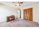 Spacious bedroom features a closet, neutral carpet, and a ceiling fan at 1735 Little Willeo Rd, Marietta, GA 30068