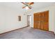 Bedroom with built in closet, ceiling fan and neutral colored carpet at 1735 Little Willeo Rd, Marietta, GA 30068