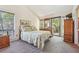 The bedroom features a double bed, wooded views, and a sliding glass door to the outside at 1735 Little Willeo Rd, Marietta, GA 30068
