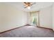 Bedroom with large window offering natural light and ceiling fan for comfort at 1735 Little Willeo Rd, Marietta, GA 30068