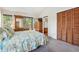Comfortable bedroom is furnished with a double bed and dressers and includes a closet for storage at 1735 Little Willeo Rd, Marietta, GA 30068