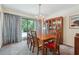 Spacious dining room features a dark wooden table and chairs, a glass door to the exterior, and a hutch at 1735 Little Willeo Rd, Marietta, GA 30068