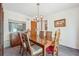 Dining room is furnished with a wooden table, a chandelier, and features a cabinet for storage at 1735 Little Willeo Rd, Marietta, GA 30068