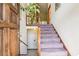 Foyer featuring a staircase with carpet steps leading to a landing area with wooden railing at 1735 Little Willeo Rd, Marietta, GA 30068