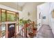 Bright foyer featuring a staircase, large windows overlooking greenery, and a view into the hallway at 1735 Little Willeo Rd, Marietta, GA 30068