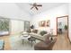 Comfortable living room with vaulted ceiling, hardwood floors, stylish furniture, and access to dining area at 1735 Little Willeo Rd, Marietta, GA 30068