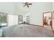 Spacious living room has vaulted ceiling, ceiling fan, and sliding glass doors to the exterior patio at 1735 Little Willeo Rd, Marietta, GA 30068