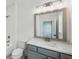 Well-lit bathroom with a modern vanity, spacious tub, and white tile surround creating a clean aesthetic at 2193 Virginia Ne Pl, Atlanta, GA 30305