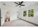 Bright bedroom with plush carpet, ceiling fan, and natural light from double windows at 2193 Virginia Ne Pl, Atlanta, GA 30305
