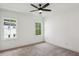 Bright and airy bedroom with neutral carpet, ceiling fan, and bright windows at 2193 Virginia Ne Pl, Atlanta, GA 30305